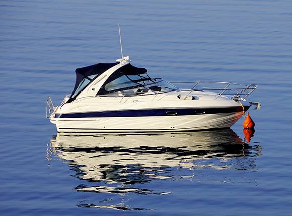 Boat on the lake covered with auto insurance in Durham