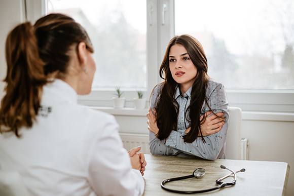 a woman listening to her options regarding Life Insurance in Raleigh, Chapel Hill, Wake Forest, Cary, Morrisville, NC, Durham